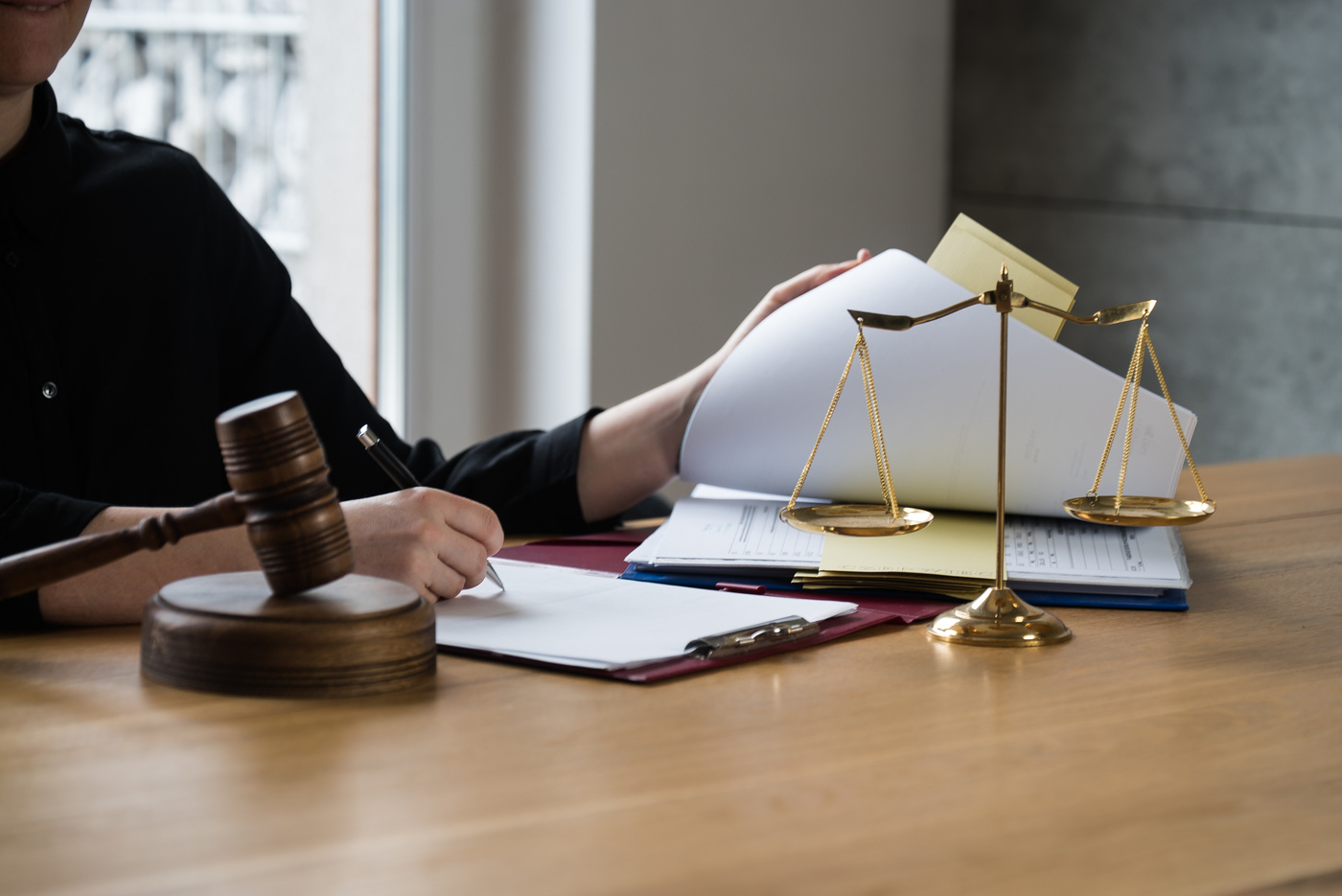 female lawyer working at the law firms. Judge gavel with scales